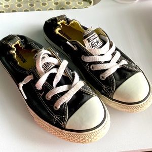 Black Converse shoreline slip-ons.